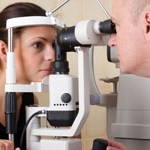 male ophthalmologist conducting an eye examination
