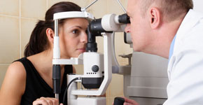 male ophthalmologist conducting an eye examination