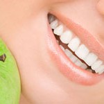 healthy teeth and green apple