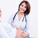 Doctor touches the belly's pregnant