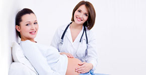 Doctor touches the belly's pregnant