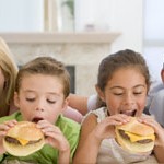 Family Eating Cheeseburgers Together